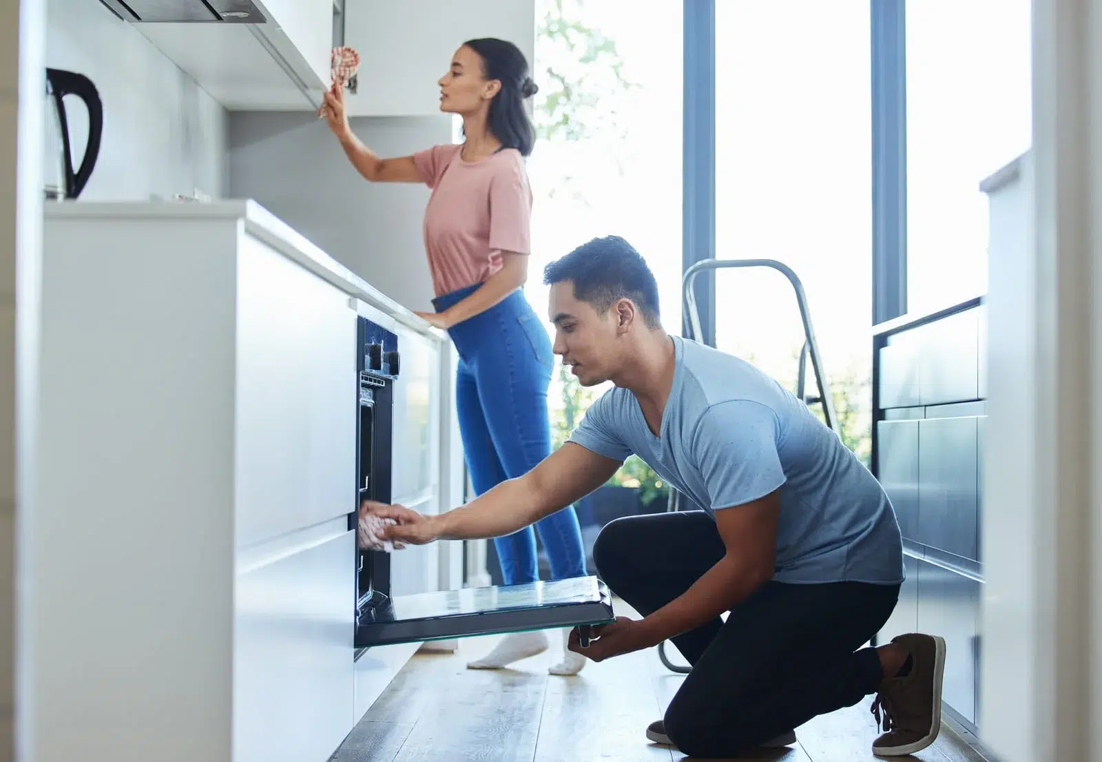 Sparkly Maids pros cleaning a modern kitchen